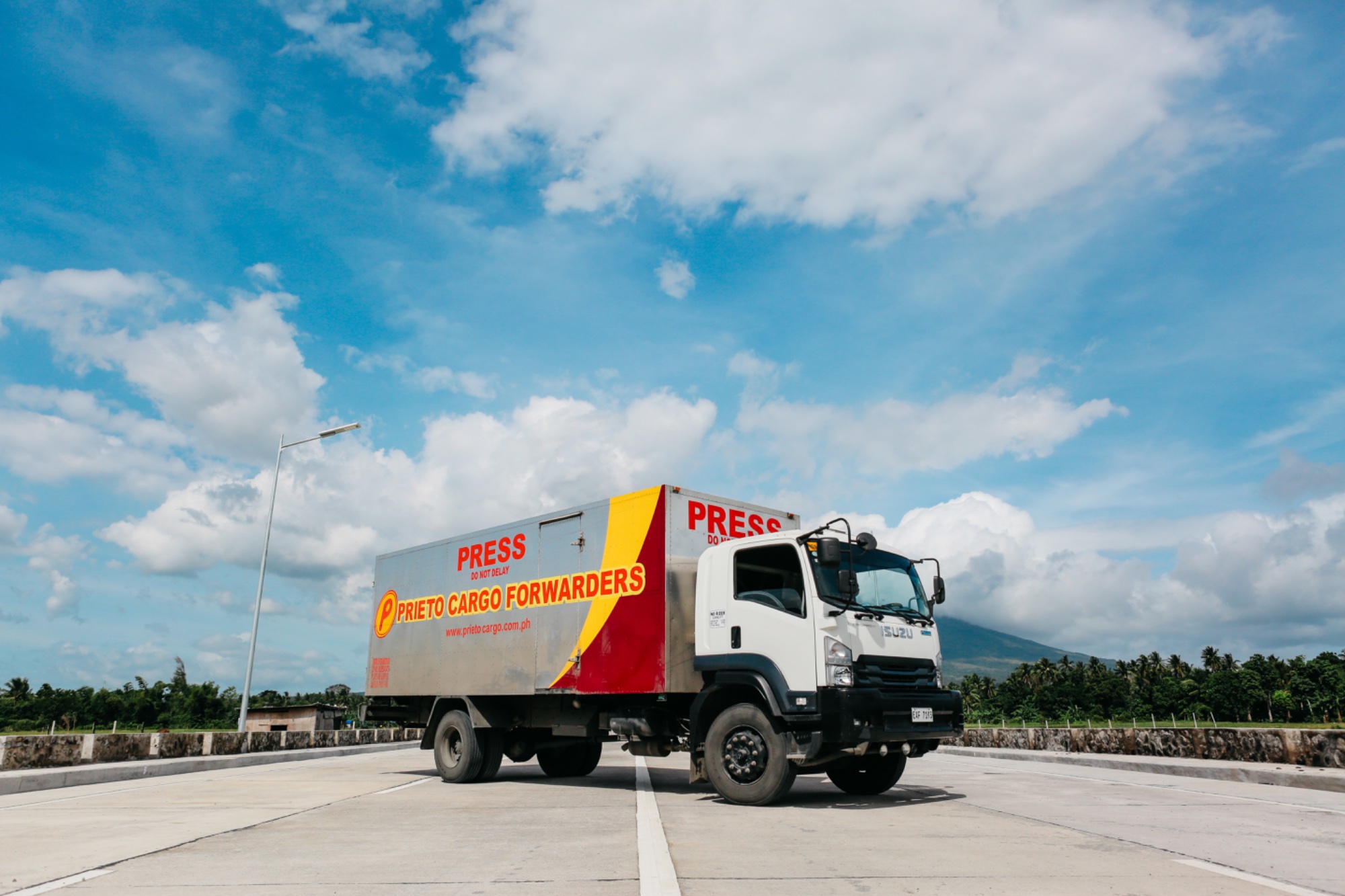 Prieto Cargo Forwarders truck with Mount Mayon in the background